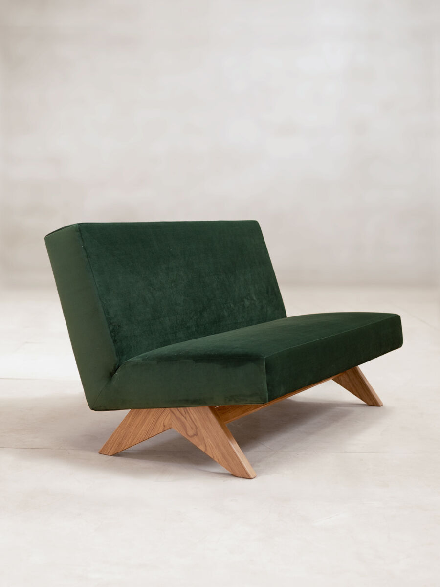 The Upholstered Armless Sofa is a re edition of the Phantom Hands